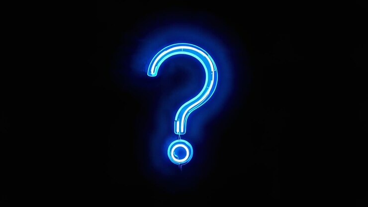 Powering blue neon question-mark sign brightening on black wall, showing halo, dual tubing and cord