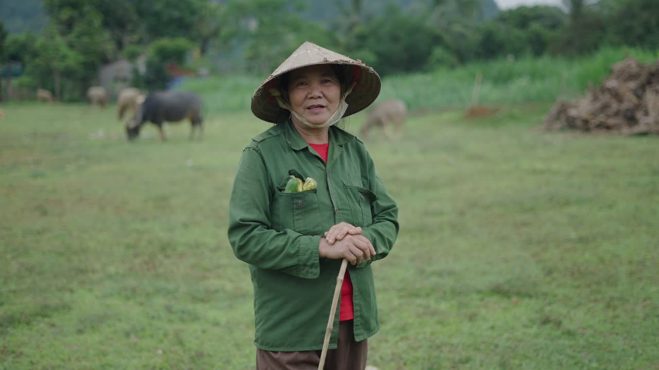 Smiling Elderly Farmer in a Vietnamese Field