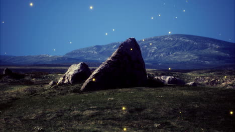 mystical glow surrounds a large rock in a serene landscape at night