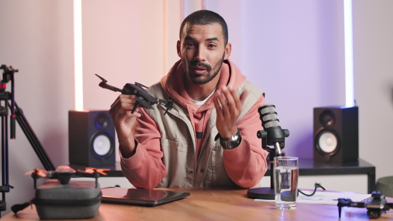 Man vlogging about drones with professional equipment