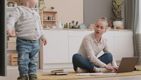 toddler running around working mom