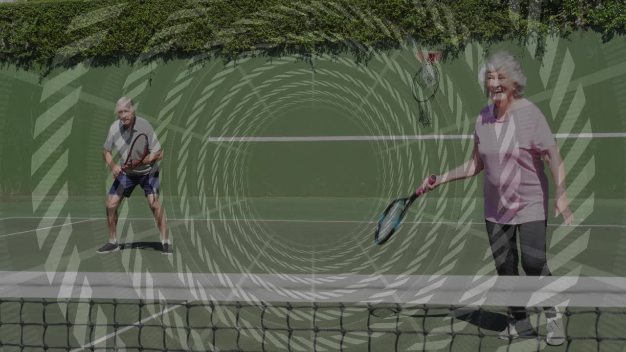 Senior couple playing tennis on green court, showing animated heart icons and fitness graph