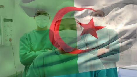 animation of waving algeria flag against team of diverse surgeons standing at hospital