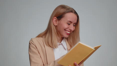 happy woman reading funny interesting fairytale story book leisure hobby education learning