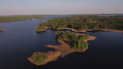 aerial of a lake and forest in sweden