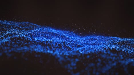 animación de ondas azules de puntos sobre un fondo negro
