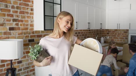 video portrait of woman with a cardboard box during moving