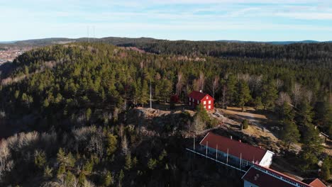 gammelgarden, hillside and forest landscape view in bengtsfors sweden - aerial shot