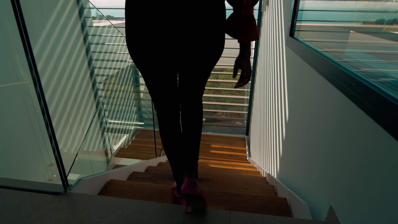 beautiful house entrance with stairs and big window to seaside