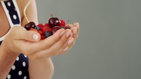 Beautiful-woman-holding-berries