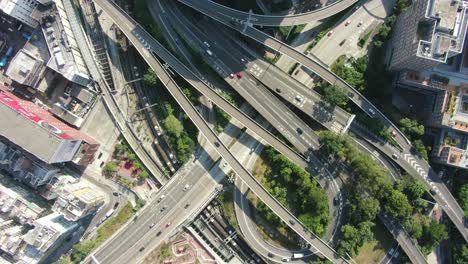 Massive-Highway-interchange-with-traffic-on-all-levels-in-downtown-Hong-Kong,-Aerial-view