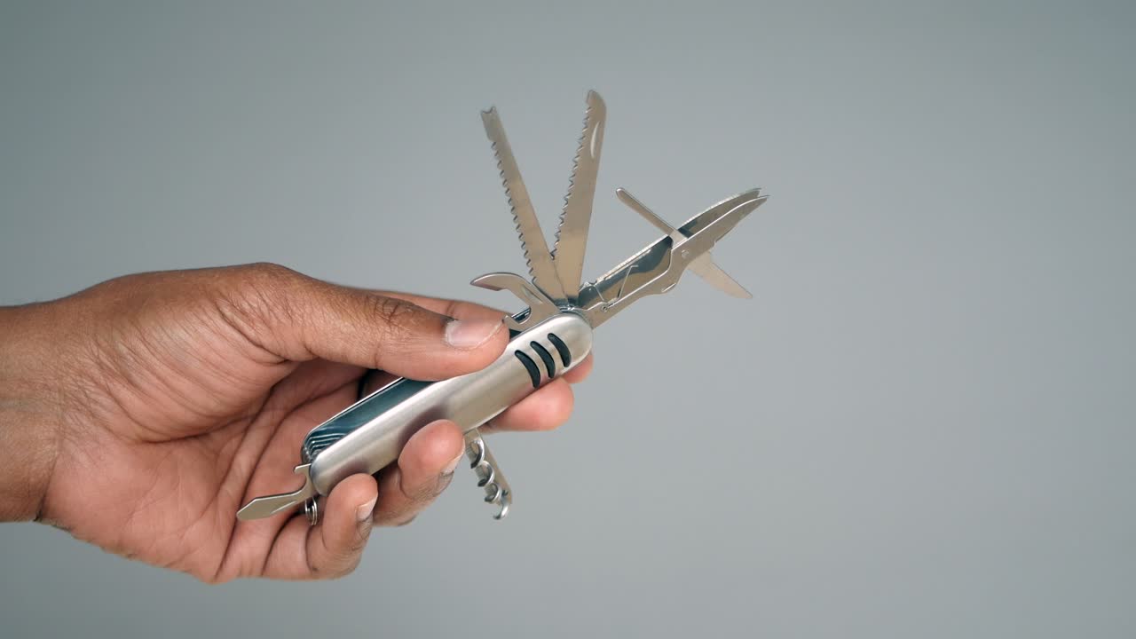 Person holding a multi-tool