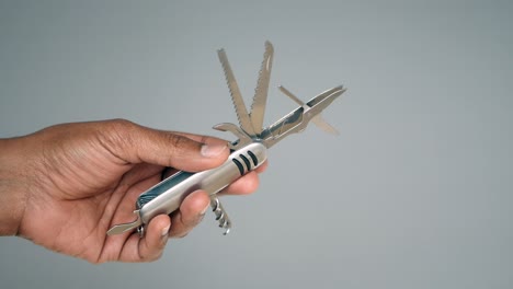 Person holding a multi-tool
