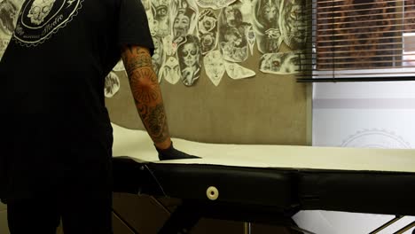 tattoo artist preparing for tattoo session