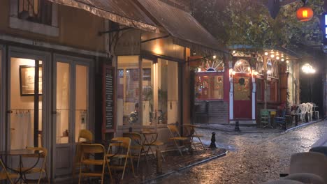 rainy evening street scene with cafes