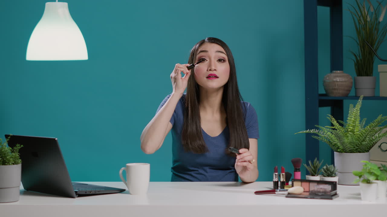 POV of content creator using mascara for makeup tutorial