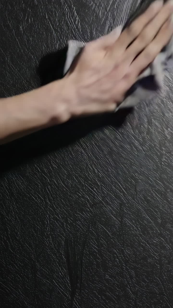 Cleaning a Dark Surface with a Cloth