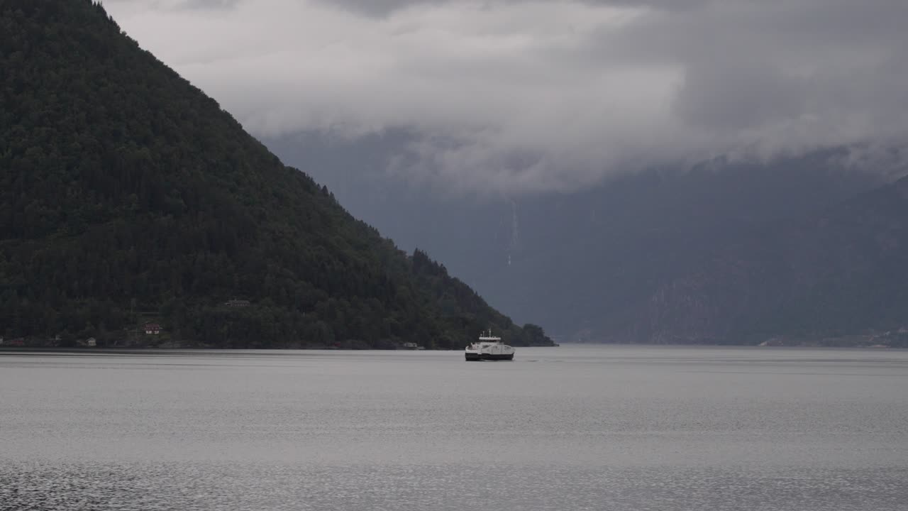 Kinsarvik ferry between Torvikbygd and Jondal, mountains and clouds