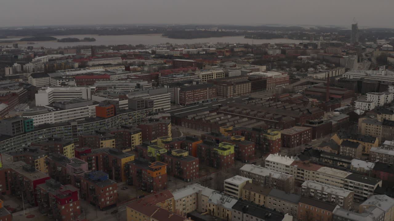 Flying over city of Helsinki in cloudy day. Aerial drone shot.