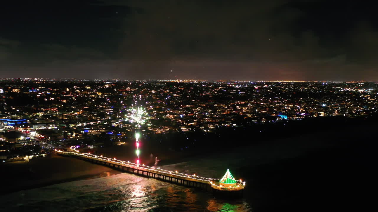 Manhattan Beach Pier Illuminated With Fireworks Display At Night
