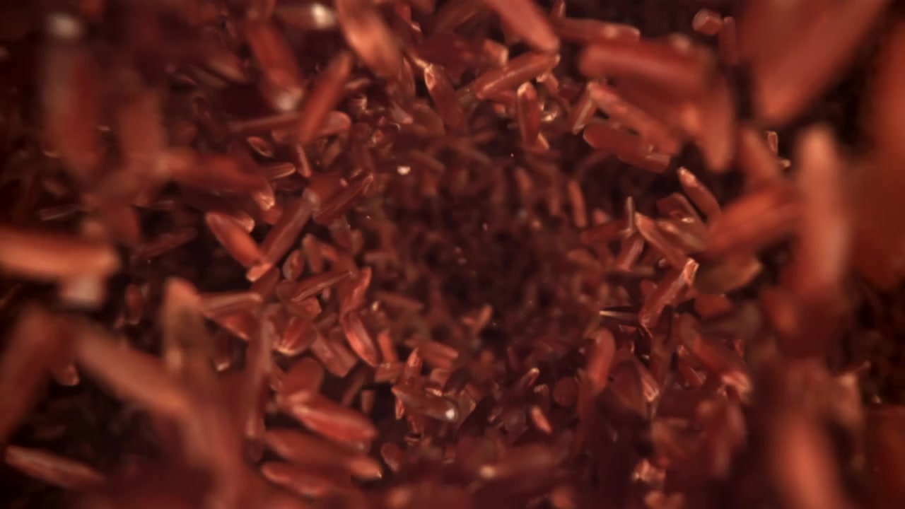 Movimento Abstrato de Grãos Vermelhos Redemoinhando em um Vórtice