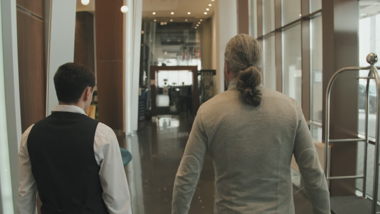 Businessman Walking into Hotel