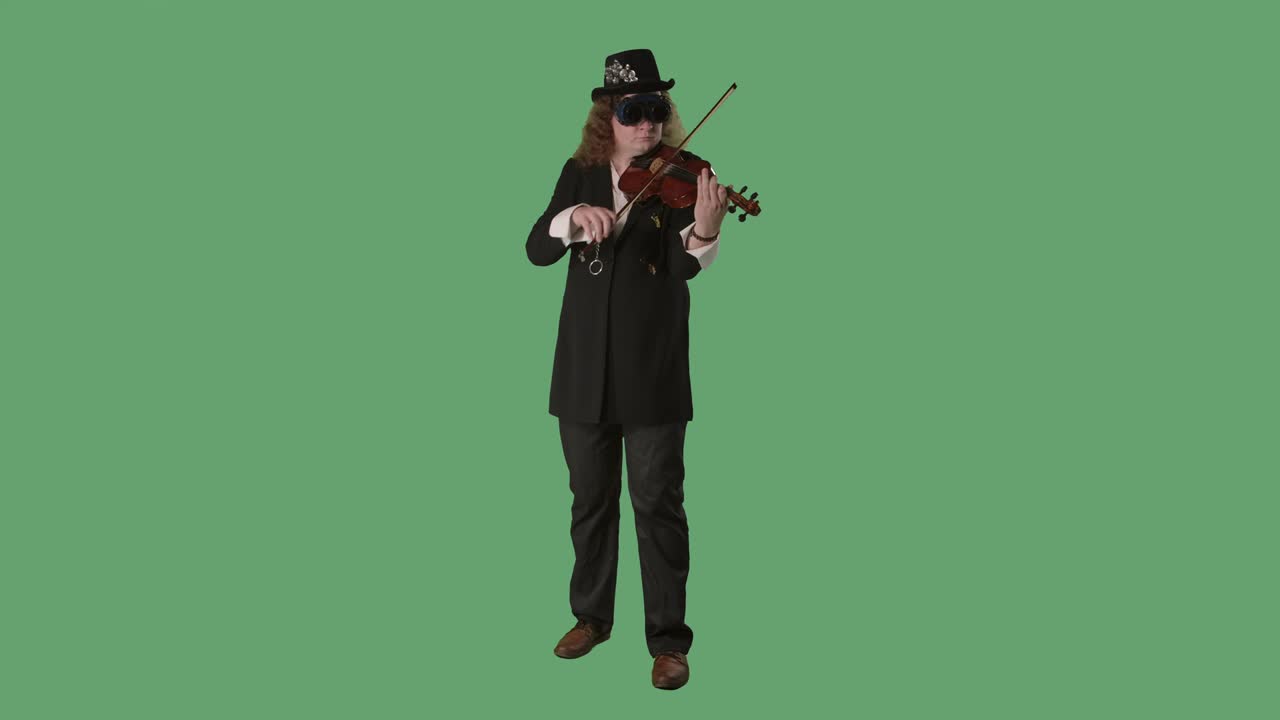 A violinist in a black suit, hat and original glasses plays the violin masterly. The man touches the strings with a bow to create a melody. Green screen chroma key. Slow motion