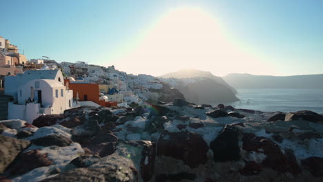 revealing shot of typical white buildings on greek island santorini, greece