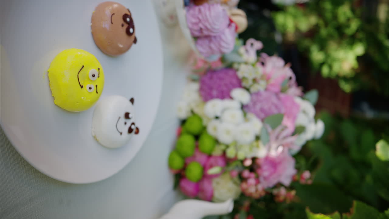 Composition with flowers, macaroons sweets desert and coffee and tea