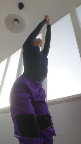 woman practicing yoga poses indoors