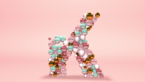 Letter-K-made-of-beads,-glass-balls,-pastel-pearls,-crystal-jewels-and-gold