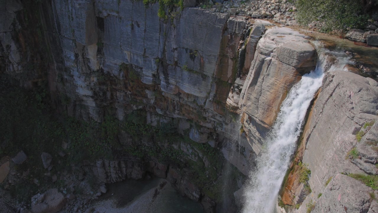Waterfall falling from the mountain rock