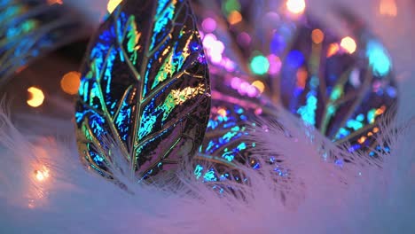 iridescent decorative leaves are glowing on soft white feathers with colorful bokeh lights in the background, creating a magical and festive atmosphere