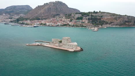 Orbital-shot-of-Bourtzi-castle-in-Nafplion,-Greece