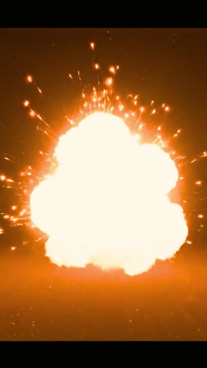 Dynamic Explosion of Light and Sparks on Dark Background