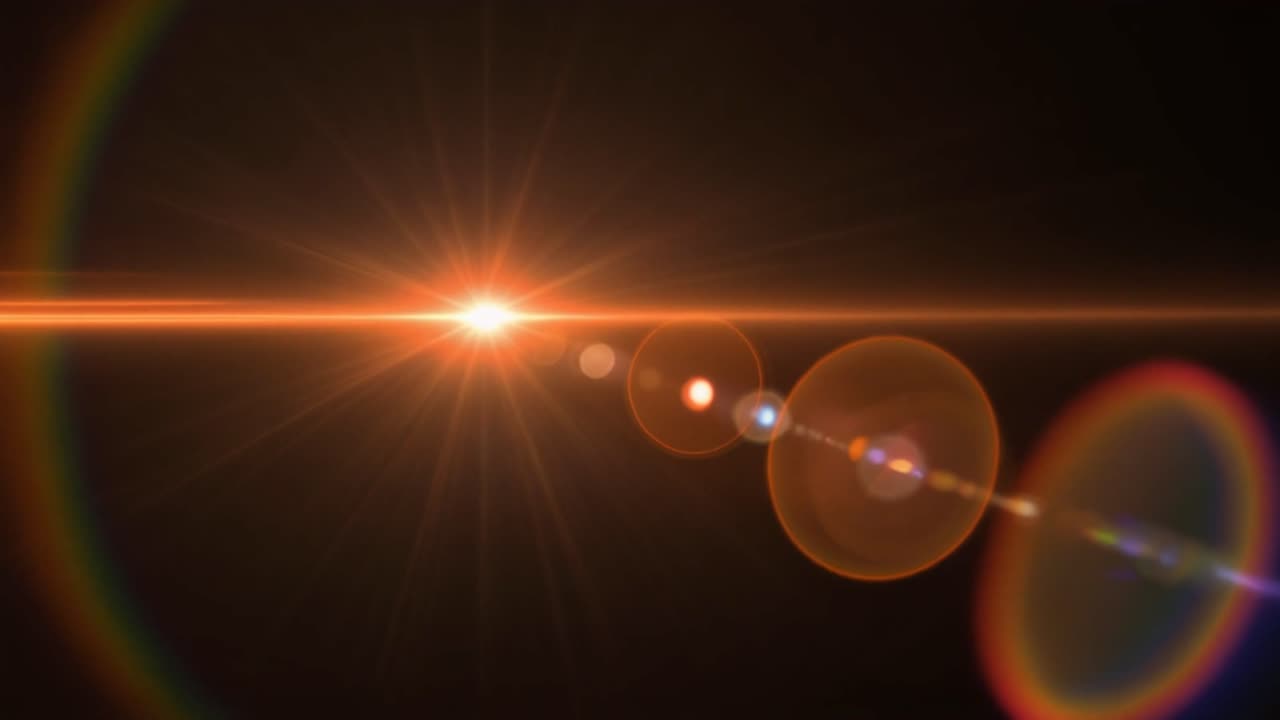 Bagliore dell'obiettivo arancione brillante che si muove su sfondo nero