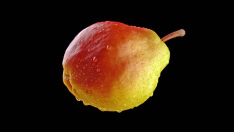 tasty pear rotates on black background