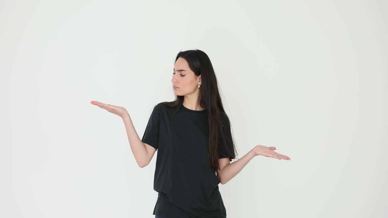 Woman in Black T-Shirt Presenting with Hands