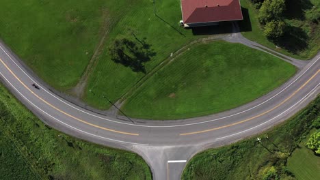 motorcycle riding big bend in road overhead