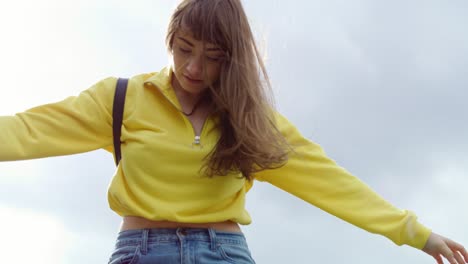 low angle view of girl balancing in the city