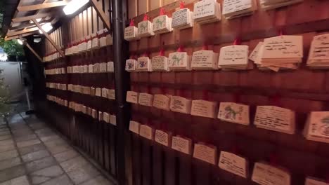 Rows-of-Ema-Wooden-Tablets-Displayed-at-Shinto-Shrines-in-Japan---Handheld-Shot