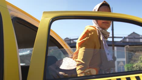 young woman wearing hijab out and about in the city