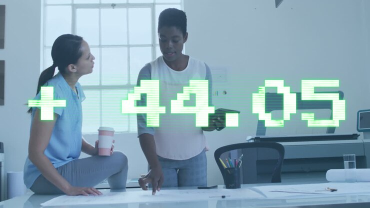 Animation of stock market data processing against two diverse women discussing over a plan at office