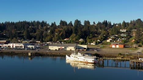 aerial push in toward moored el conquistador ship in pacific northwest