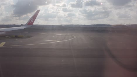 turkish airline plane going for takeoff in istanbul, view from window