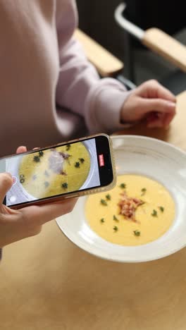 taking a picture of a creamy soup