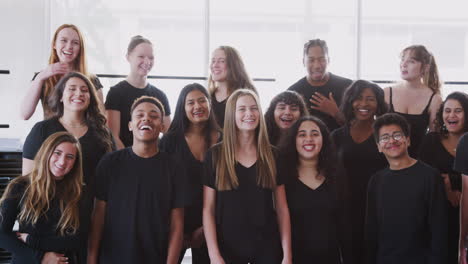 Portrait-Of-Male-And-Female-Students-In-Choir-At-Performing-Arts-School