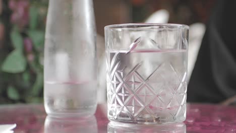 person drinking water at a cafe