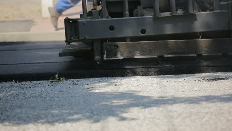 laying asphalt on the street