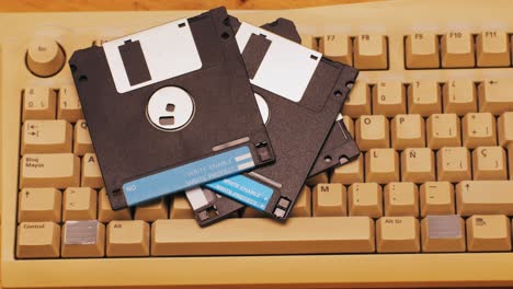 vintage floppy disks on a keyboard